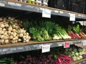 CSA vegetables on store shelves.